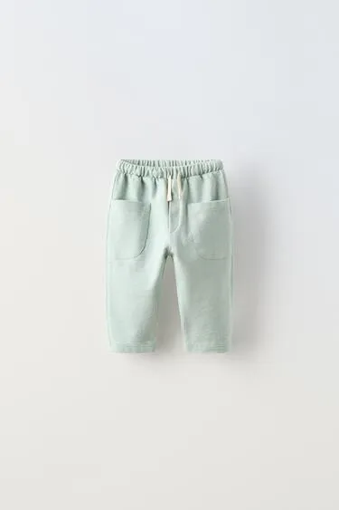 Однотонные брюки с карманами